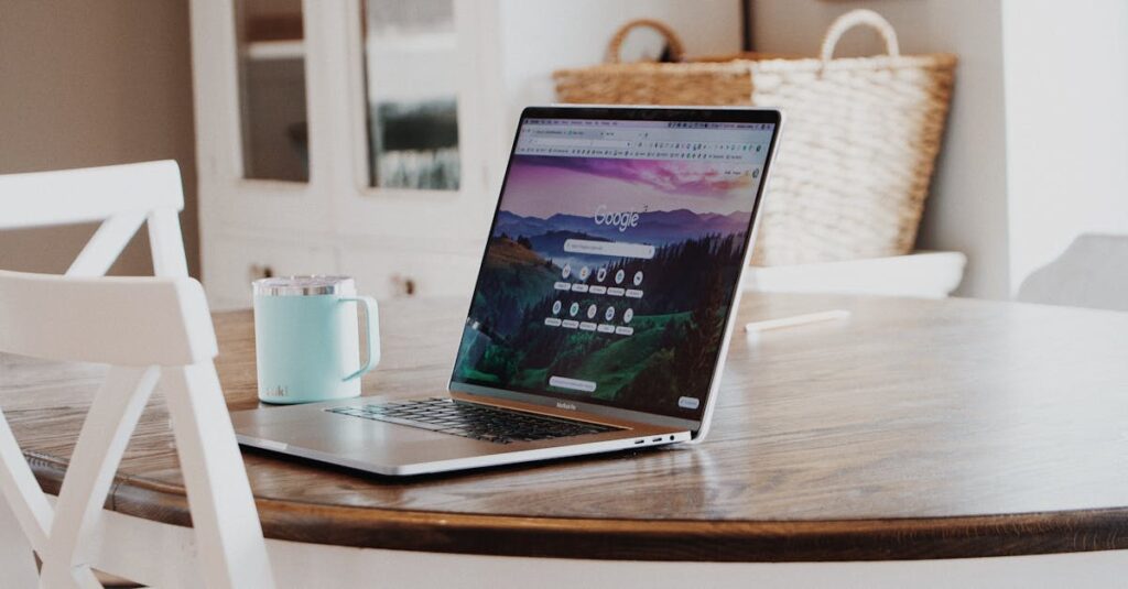 A sleek laptop on a wooden table with a mug, exemplifying a modern home workspace.